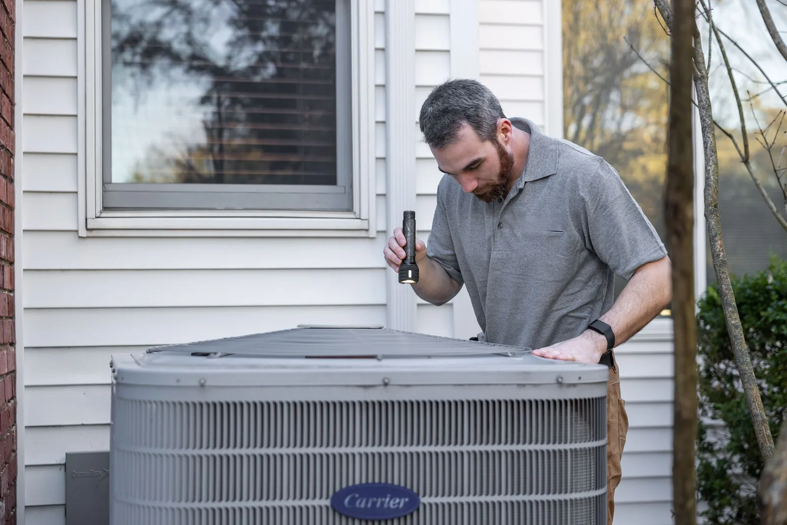 Technician inspecting HVAC equipment.